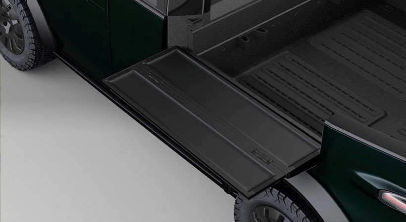 La cama de la pickup cuenta con mesas de trabajo extensibles en cada lado. Foto: Canoo